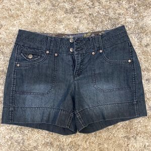 Dark wash denim shorts with double button, flap back pockets, size 6